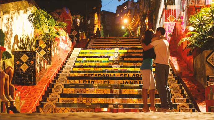 Rio de Janeiro: Sharing a quiet moment on the hand-tiled steps of the Escadaria Selarón which connects the music district of Lapa with the rest of Santa Teresa.