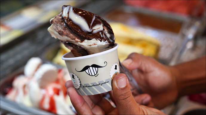 Person holding a Brazilian ice cream.